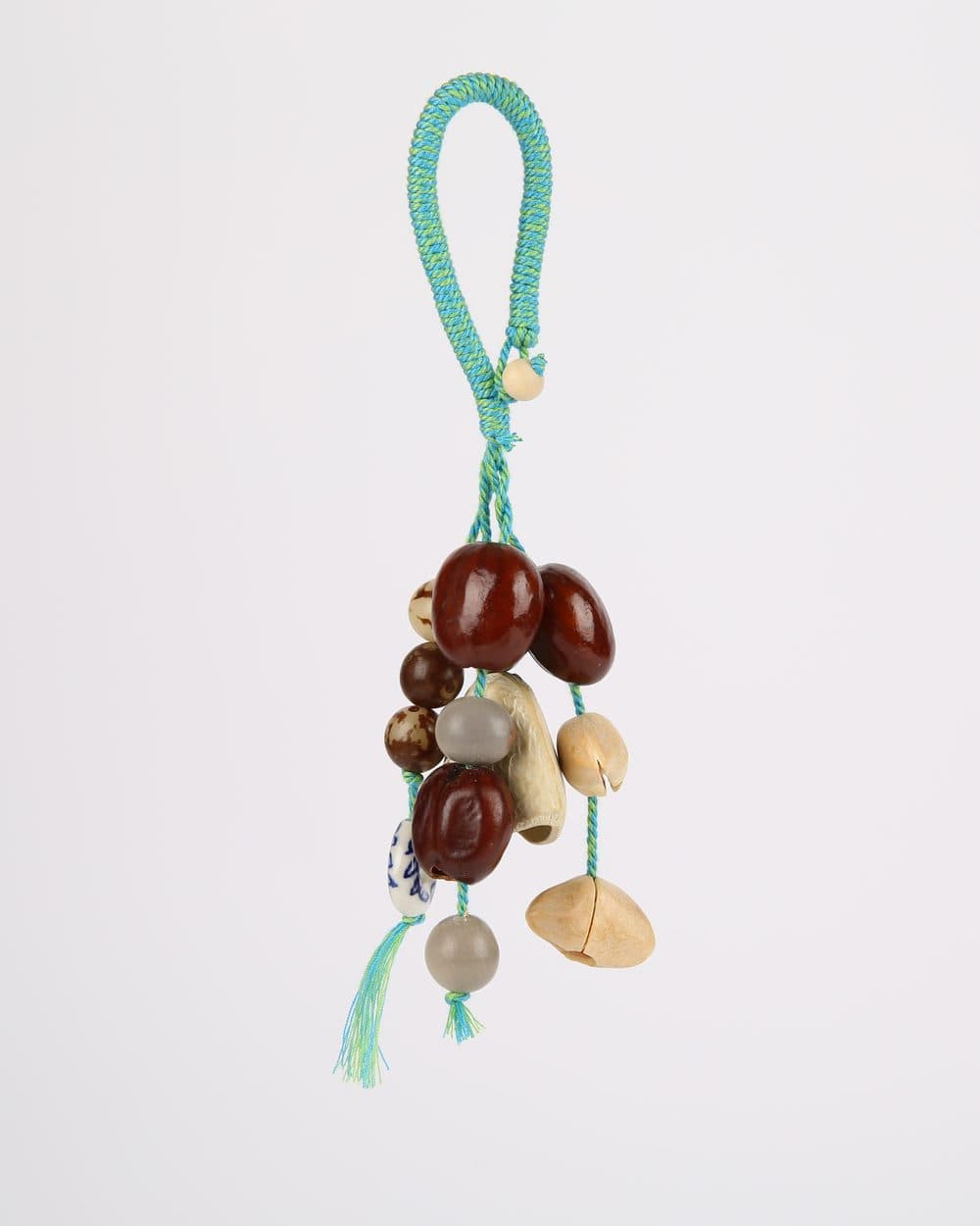Colgante de semillas con cordón turquesa